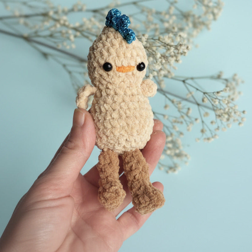 Crocheted baby chick with sparkling comb