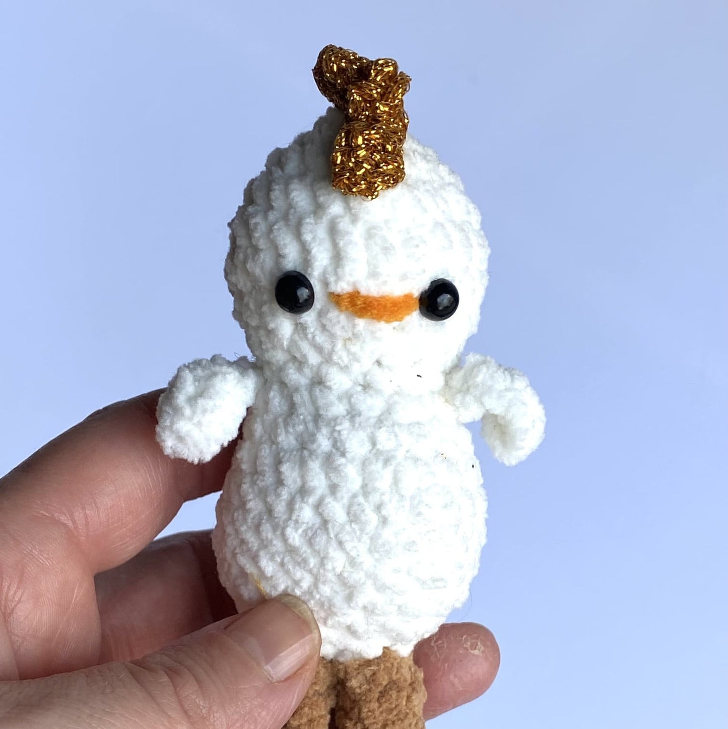 Crocheted baby chick with sparkling comb