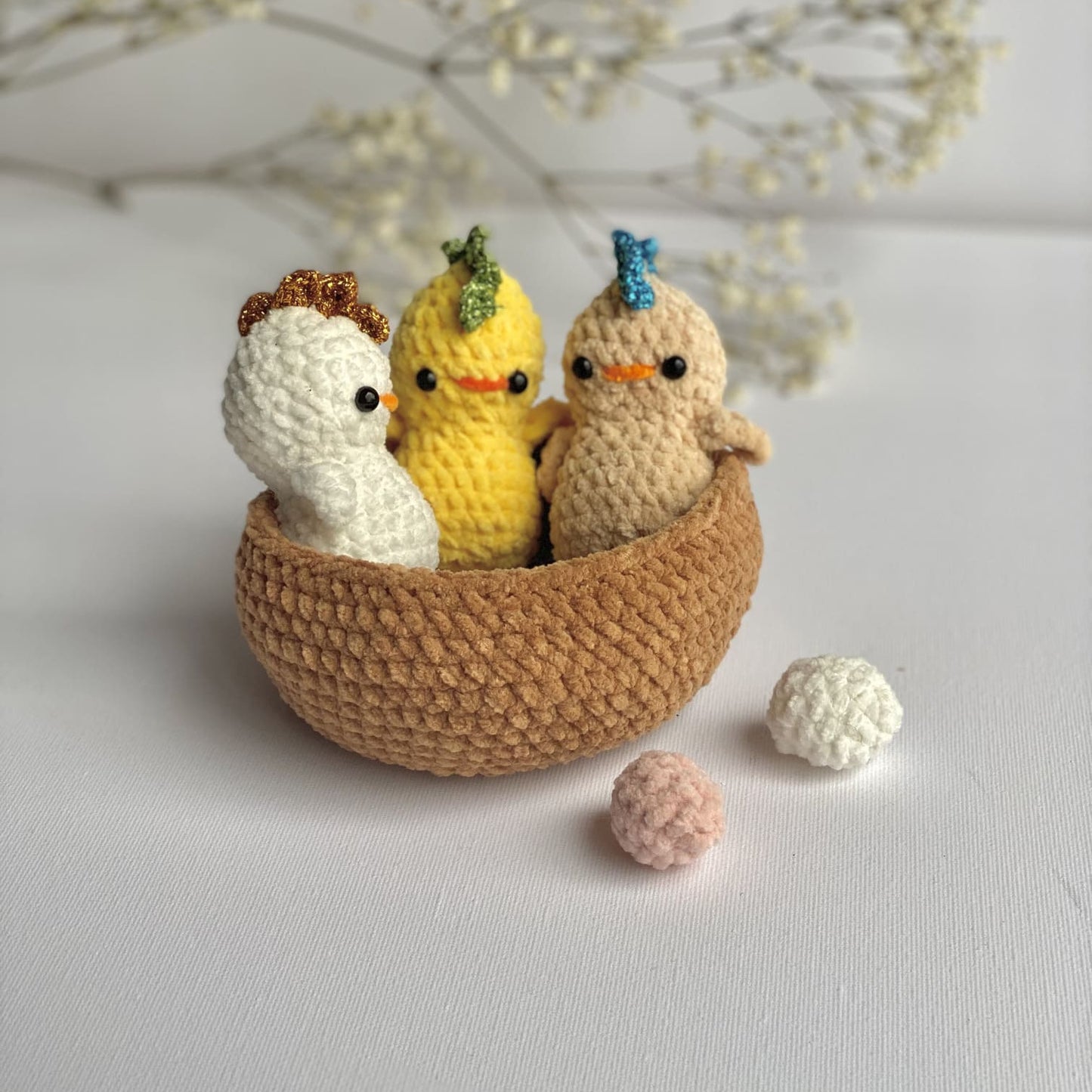 3 little chicks crocheted in a nest