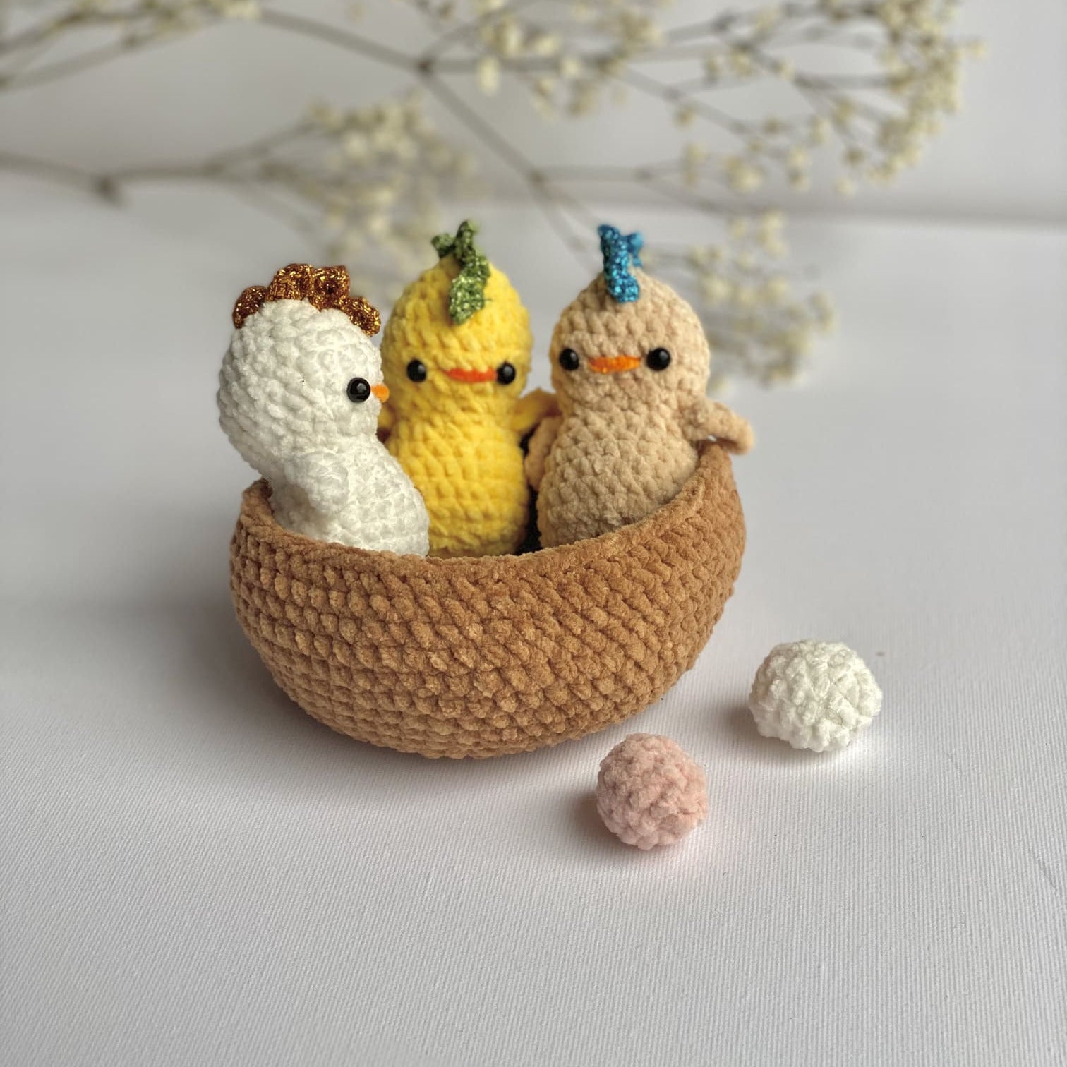 3 little chicks crocheted in a nest